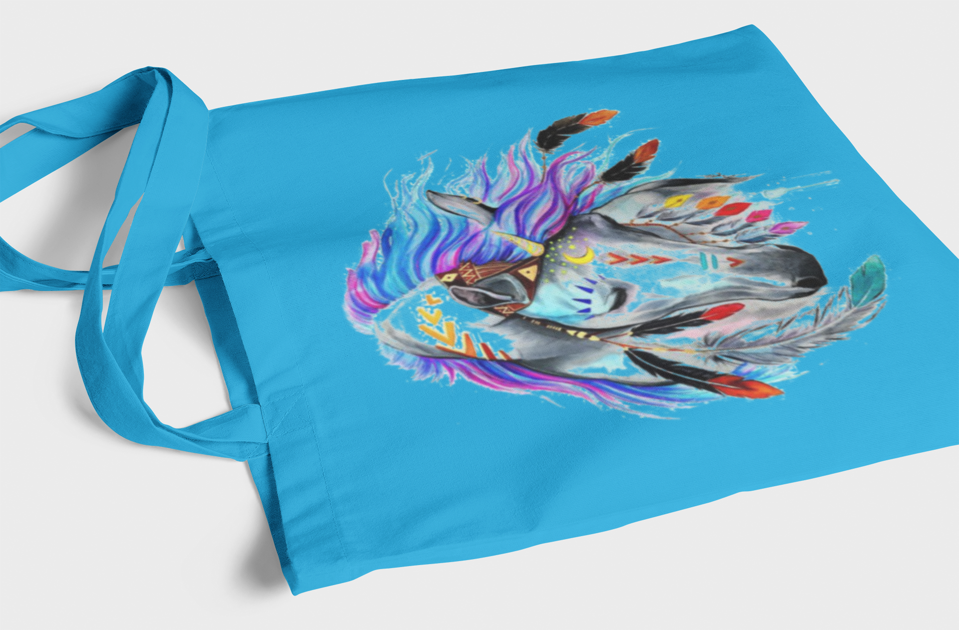 Blue tote bag with a colorful dragon design on a white background