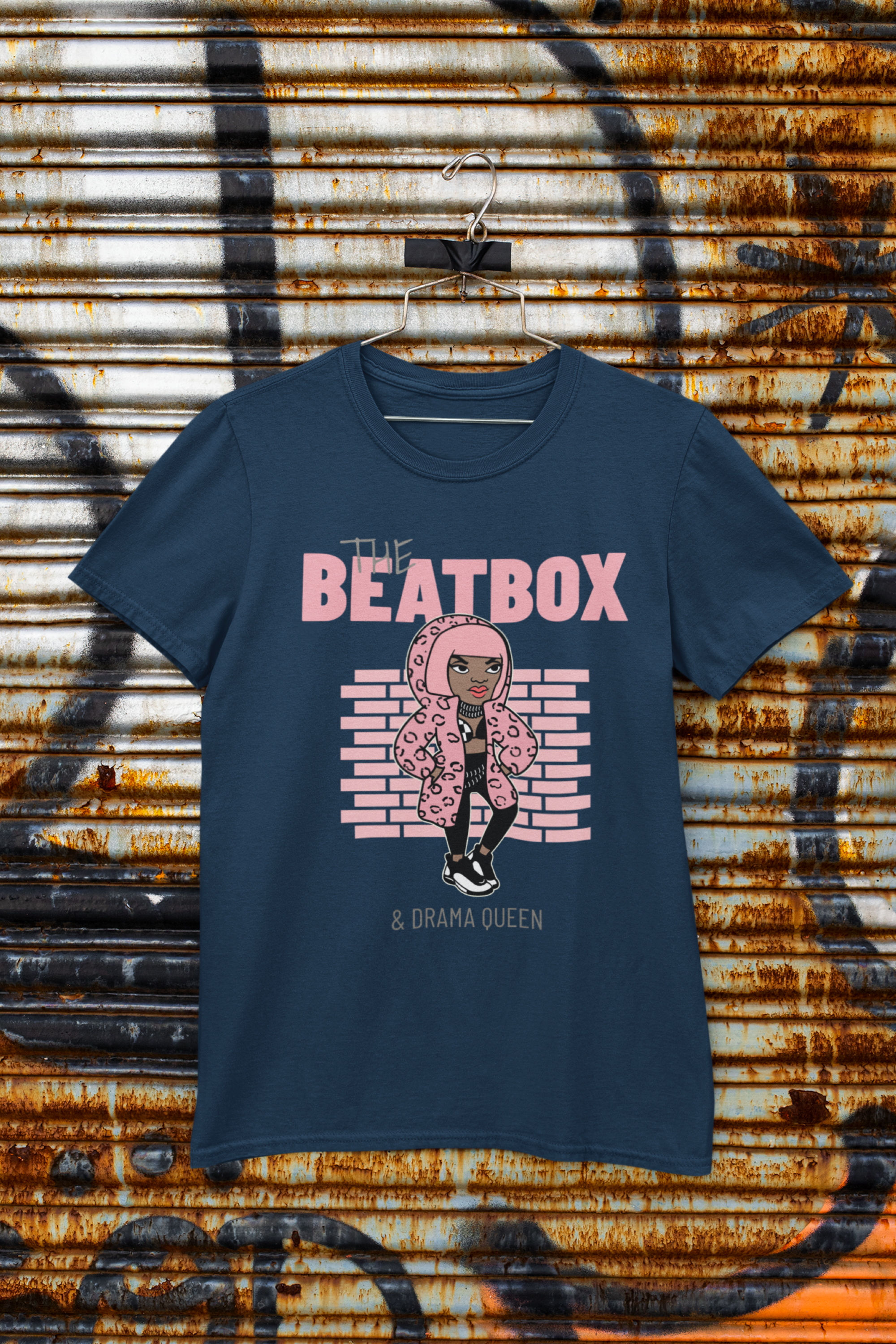 Navy blue t-shirt with 'The Beatbox & Drama Queen' graphic design on a rusty metal background