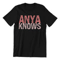 Black t-shirt with 'ANYA KNOWS' text in pink and white on a white background