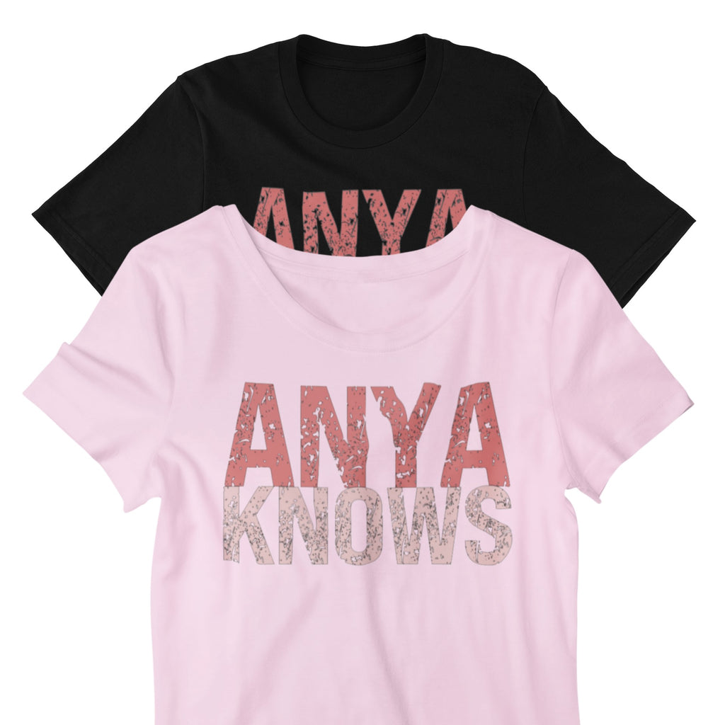 Black and pink t-shirts with 'ANYA KNOWS' text on a white background