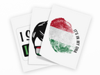 Three overlapping white cards or prints on a black background. The front card shows a fingerprint printed in the Hungarian flag colors with the text 'IT'S IN MY DNA' curved around it.