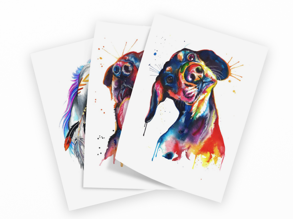 Three watercolor art prints of a dachshund dog in colorful watercolor style, fanned out on a white background.