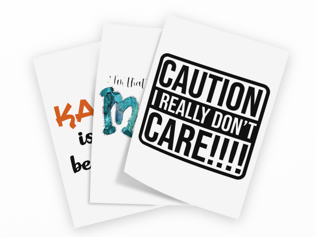 Three white greeting cards fanned out on a black background. The front card has a bold black warning-style border and the text 'CAUTION I REALLY DON'T CARE!!!!'.