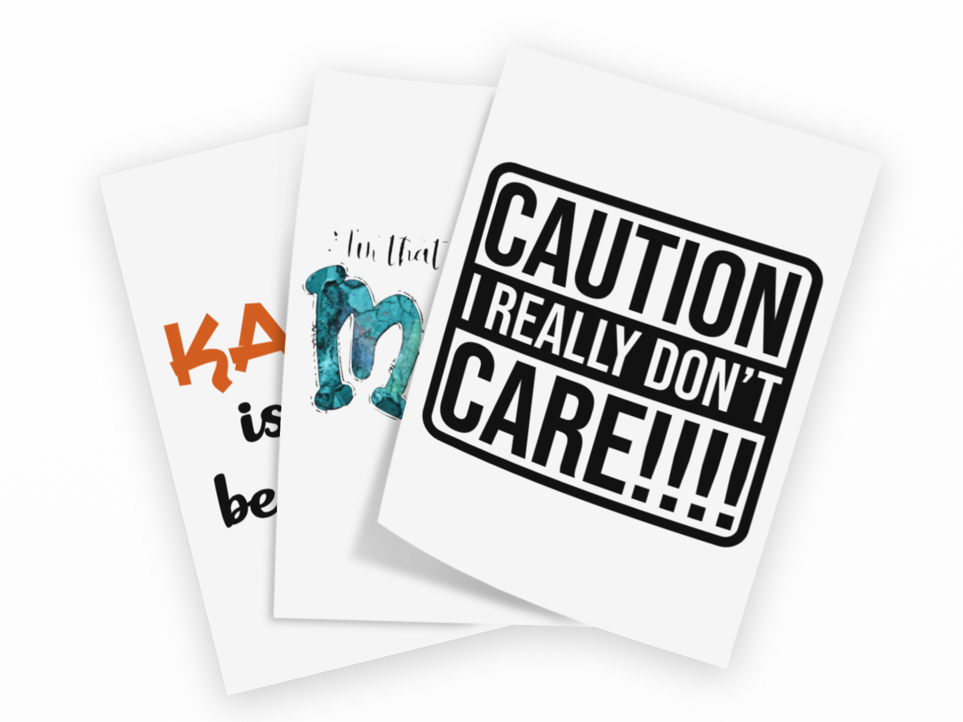 Three white greeting cards fanned out on a black background. The front card has a bold black warning-style border and the text 'CAUTION I REALLY DON'T CARE!!!!'.