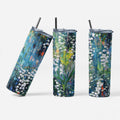 Three tumblers with floral designs on a white background
