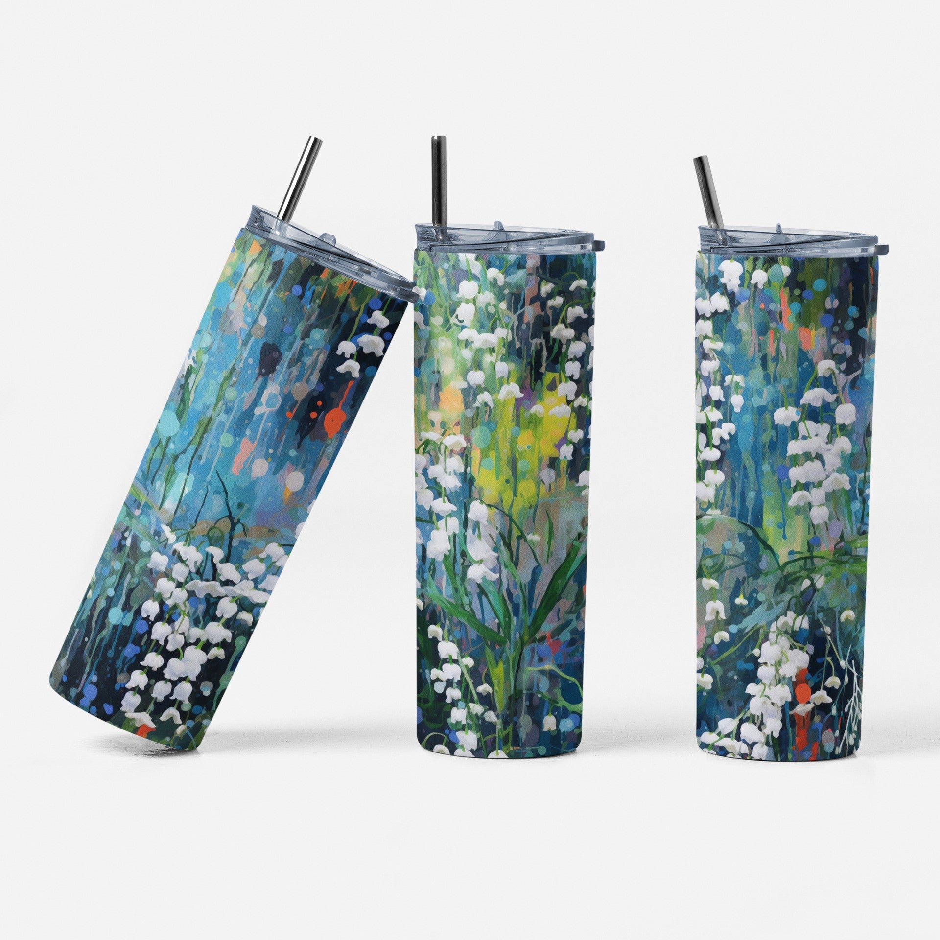 Three tumblers with floral designs on a white background