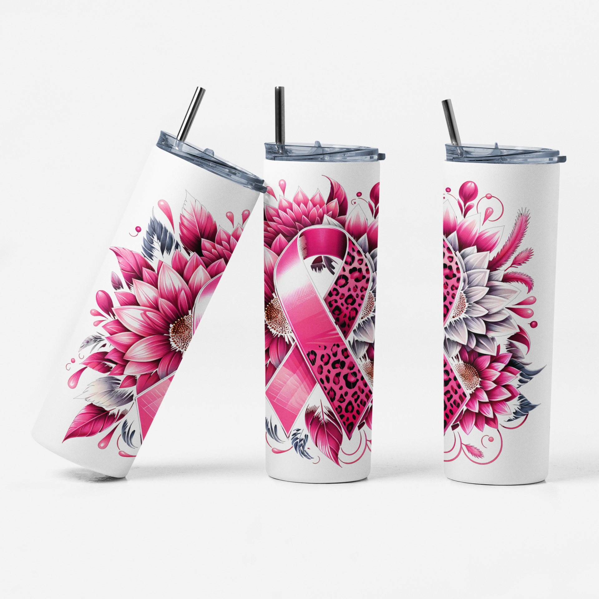Three tumblers with floral and pink ribbon designs on a white background