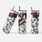 Three views of a stainless steel tumbler with a Christmas-themed wrap design, featuring a Santa Claus face, candy canes, holly, and dripping dark red chocolate on a white background, with clear lids and black straws.