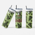 Three views of a tall insulated tumbler with a clear lid and black straw, printed with a light green holiday design featuring Christmas trees, snowflakes, and the phrase “I’m Christmas cute.”.