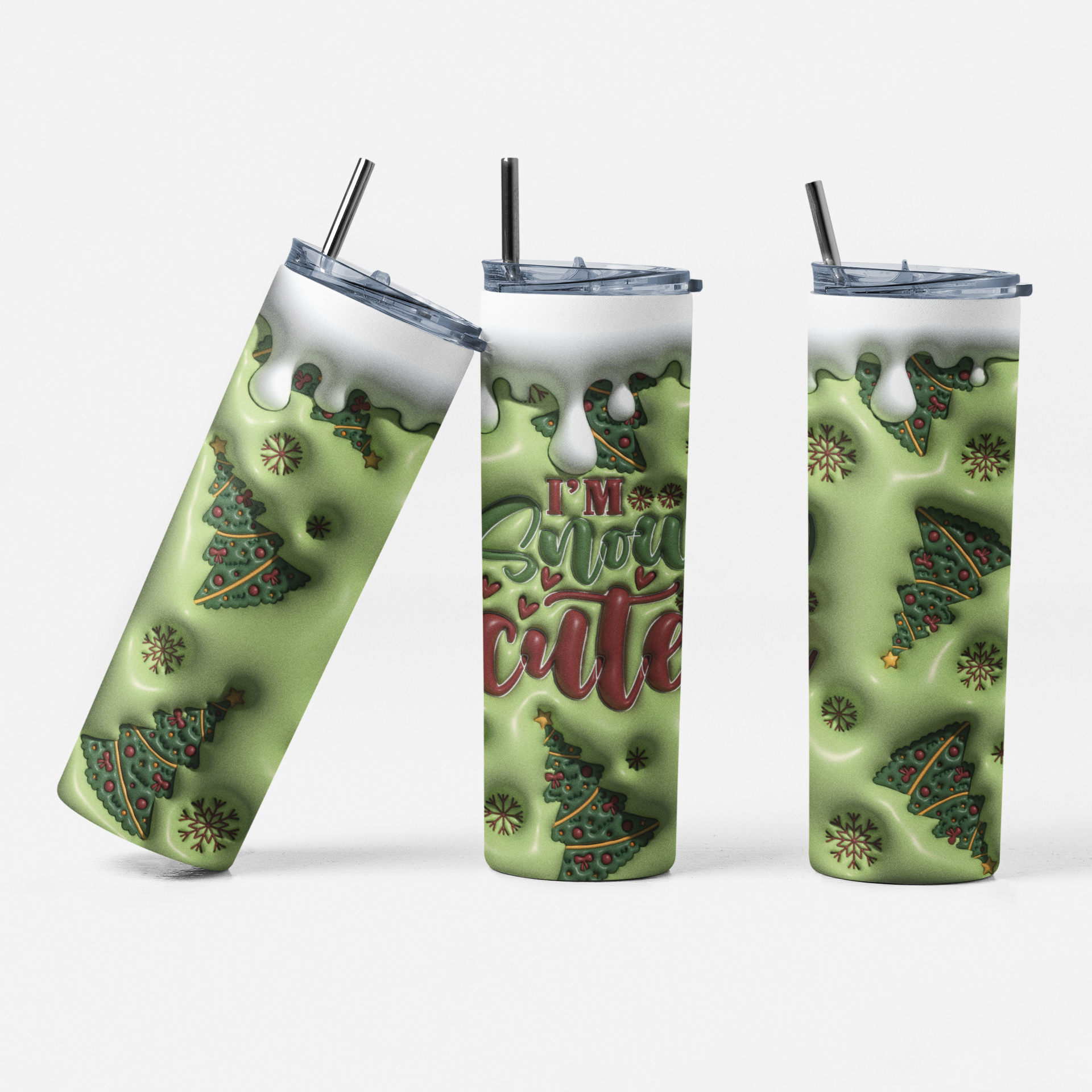 Three views of a tall insulated tumbler with a clear lid and black straw, printed with a light green holiday design featuring Christmas trees, snowflakes, and the phrase “I’m Christmas cute.”.