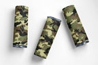 Three cylindrical objects with camouflage pattern on a white background