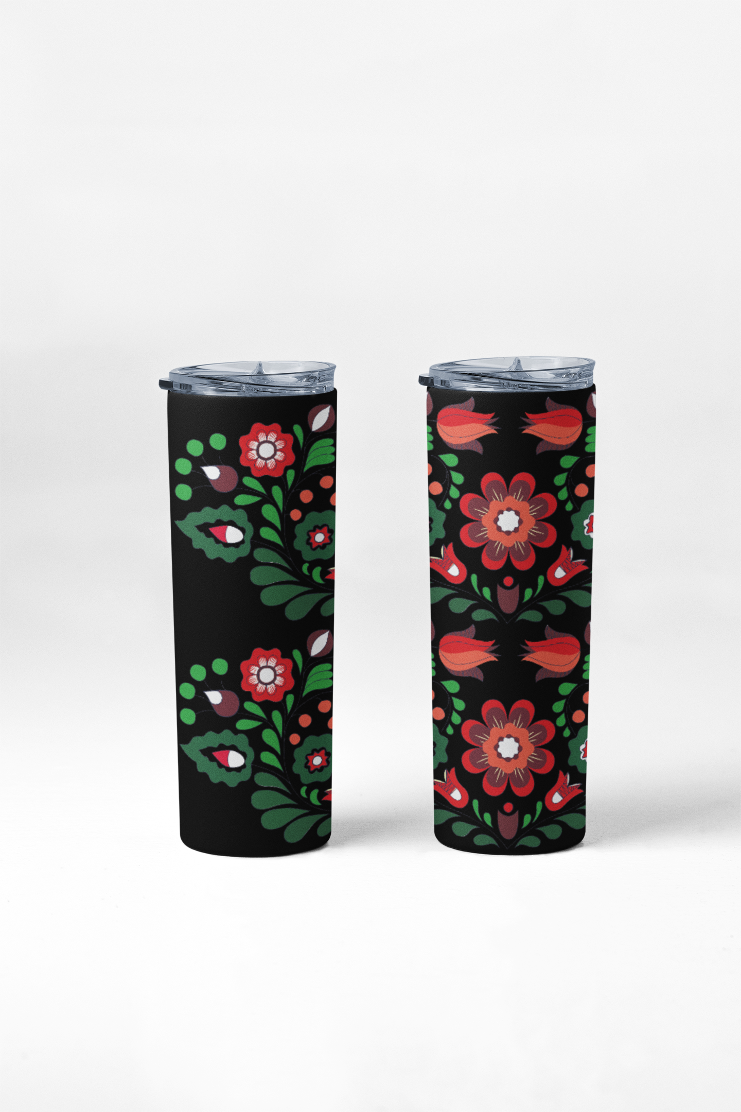 Two tumblers with floral design on a black background
