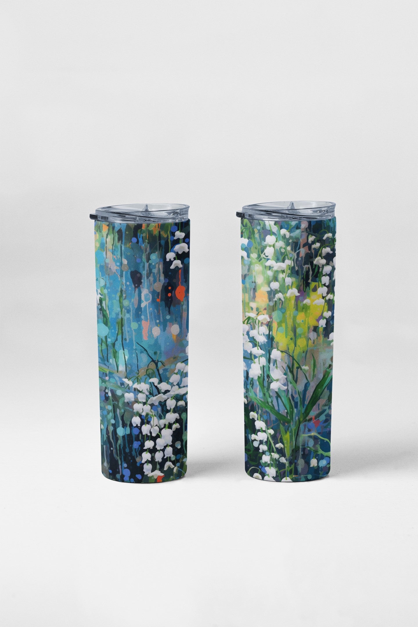 Two tumblers with floral designs on a white background