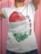 Person wearing a white t-shirt with a fingerprint design and text 'It's in my DNA' on a pink background