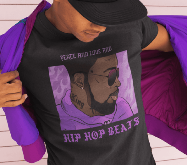 A person wearing a black graphic T-shirt with a purple-toned portrait print and the text 'PEACE AND LOVE AND HIP HOP BEATS,' while opening a bright purple jacket. The person is also wearing a black cap.