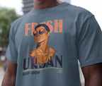 Person wearing a t-shirt with a graphic design and text.