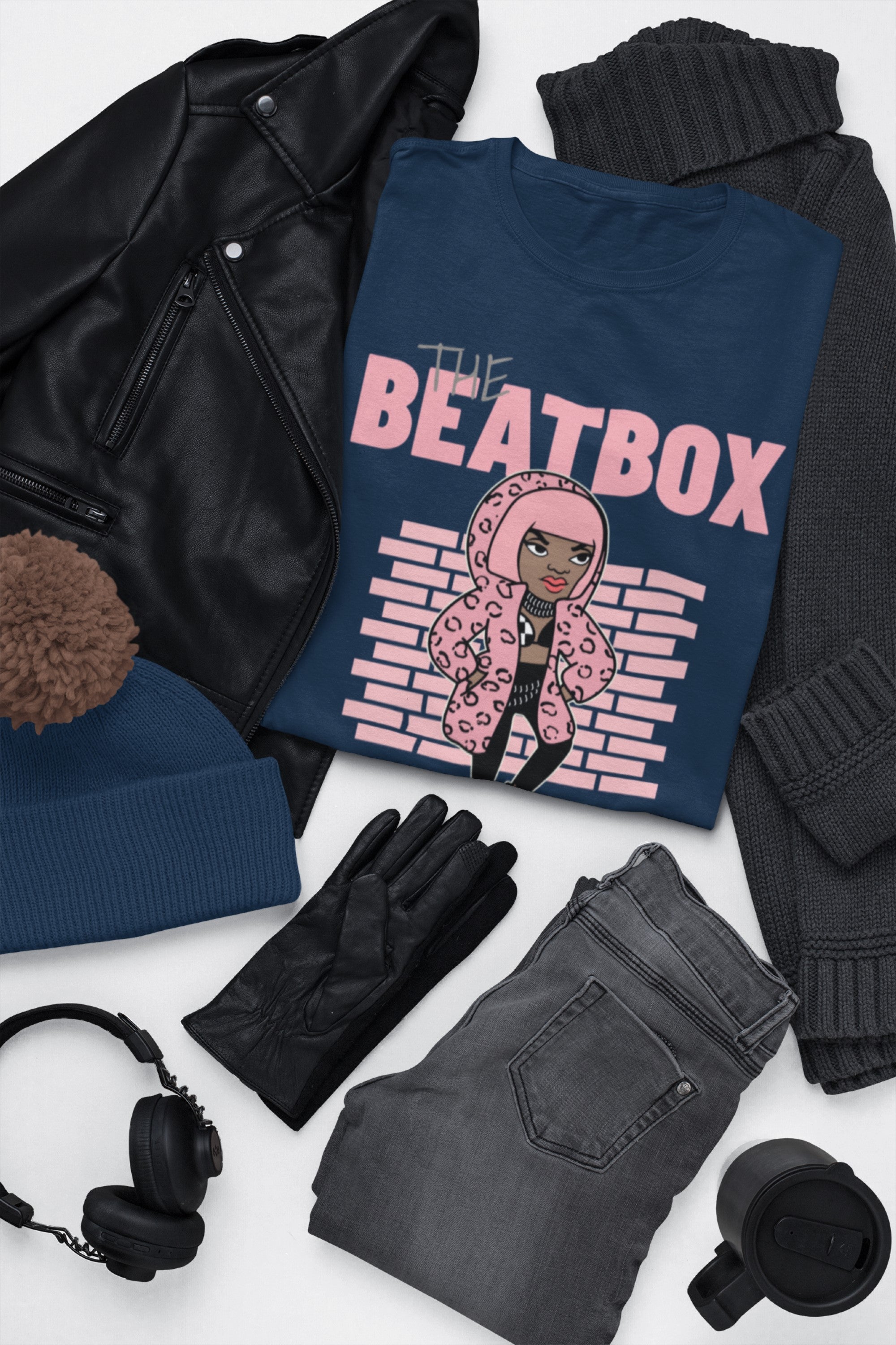 Navy blue t-shirt with 'The Beatbox' design on a white surface with black leather jacket, gray jeans, black gloves, and headphones.