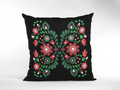 Decorative pillow with floral pattern on a black background