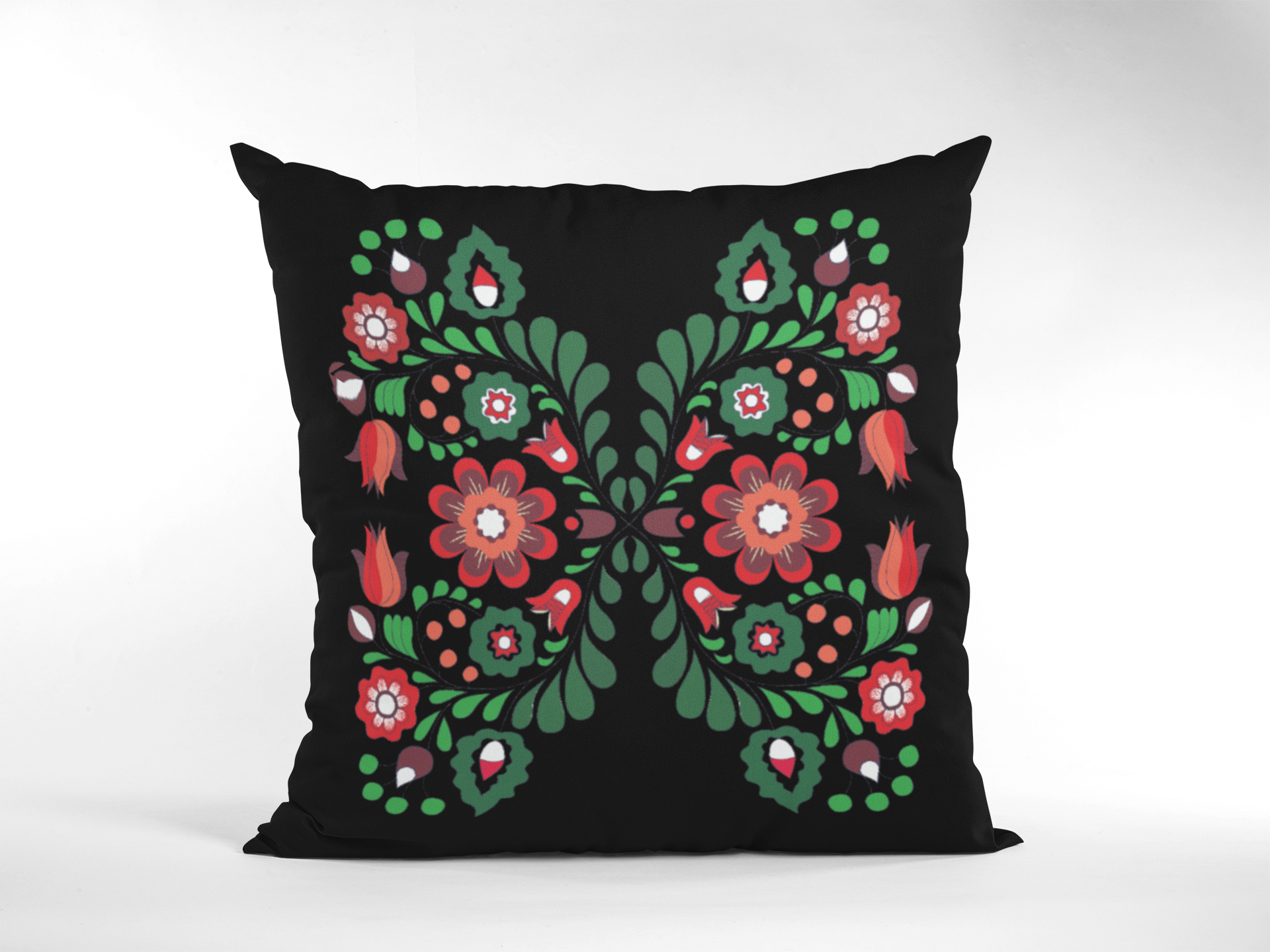 Decorative pillow with floral pattern on a black background