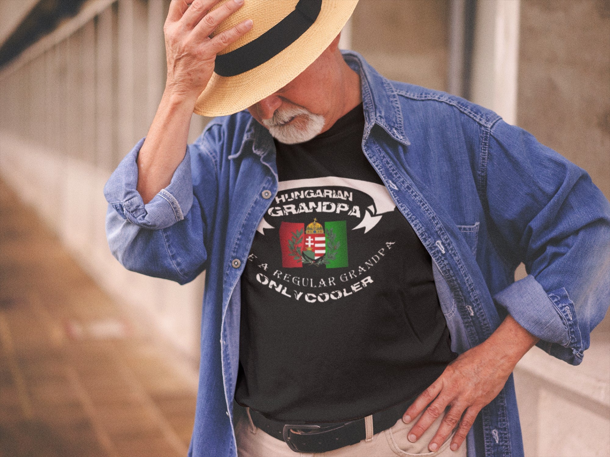 Man wearing a black t-shirt with 'Hungarian Grandpa' text and a flag design, standing outdoors.