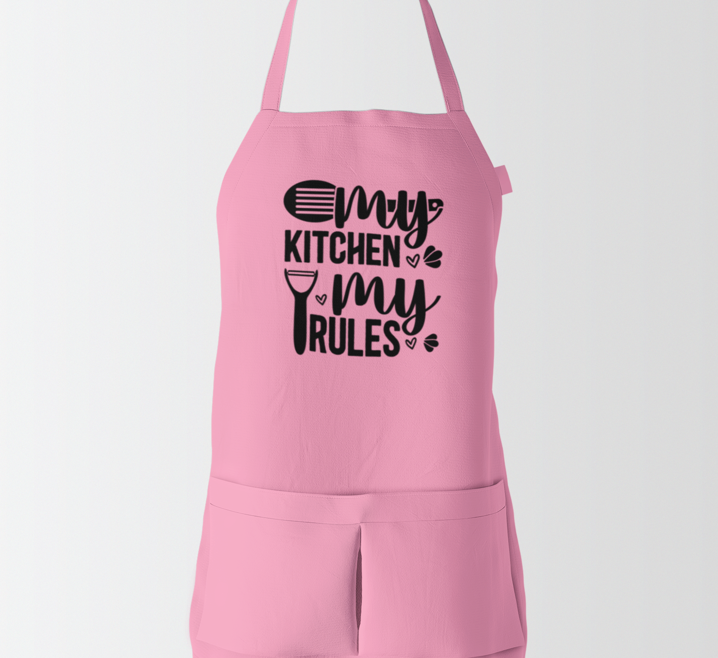 Pink apron with 'My Kitchen My Rules' text on a white background