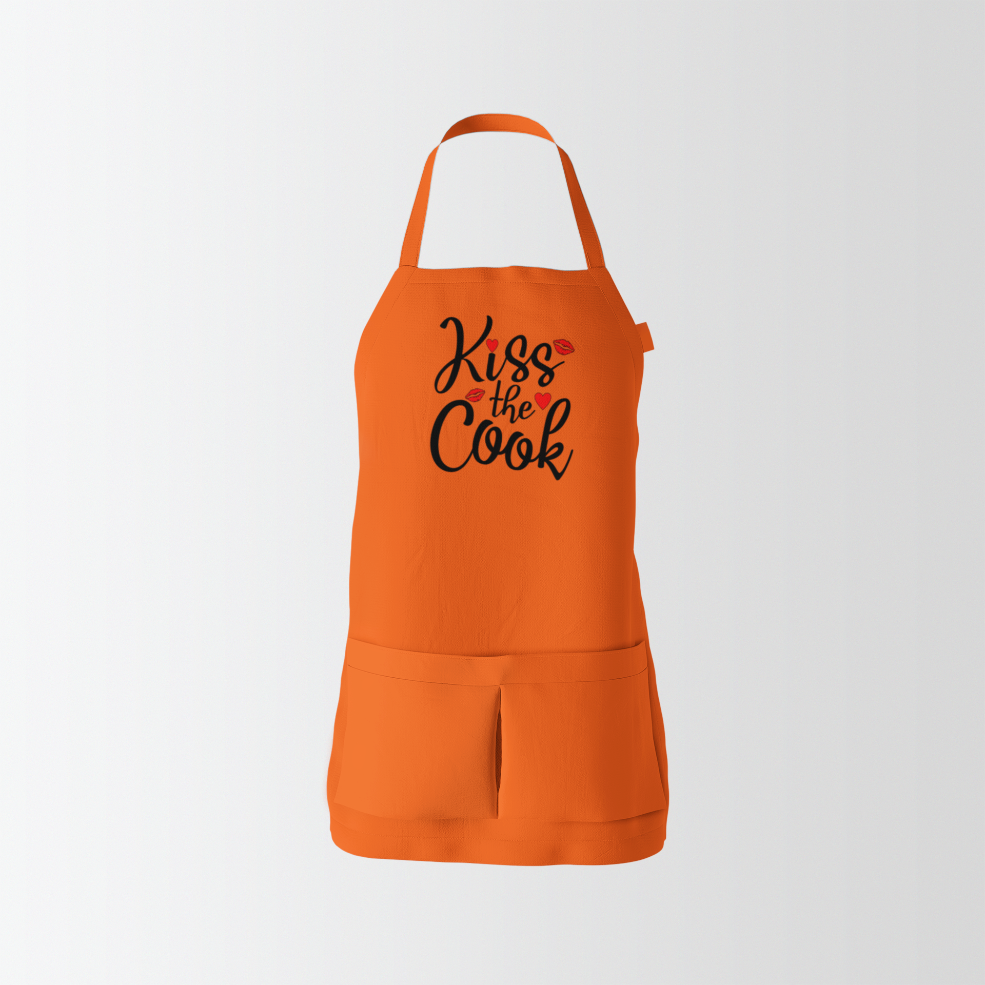 Orange apron with 'Kiss the Cook' text on a white background