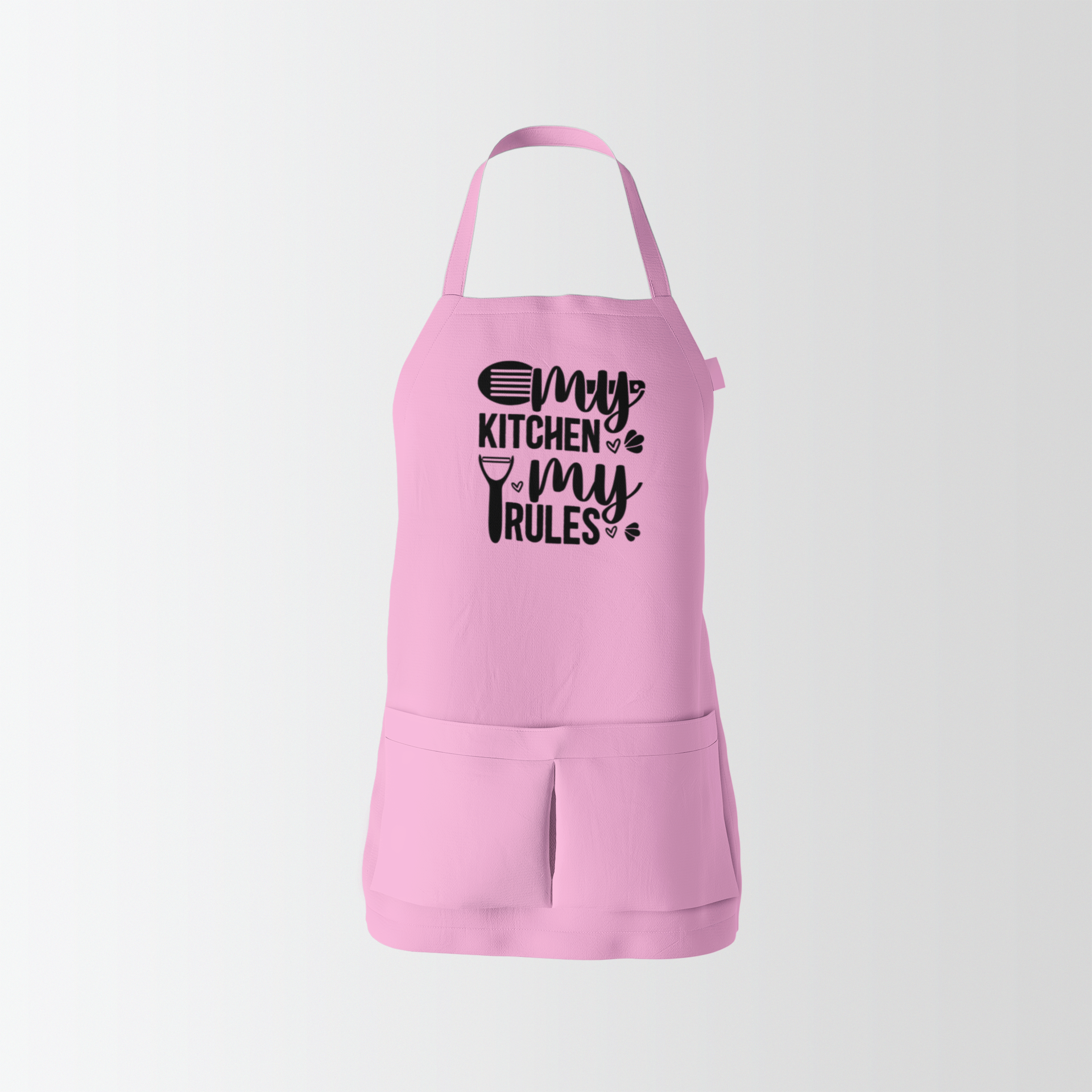 Pink apron with 'My Kitchen My Rules' text on a light gray background