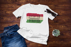 White t-shirt with 'HAPPY FOREVER' design on a wooden surface with jeans and sunglasses.