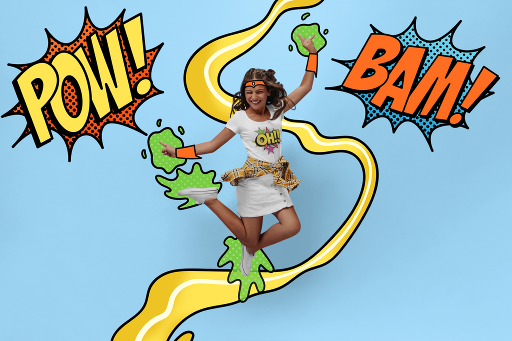 A woman in a white t-shirt and leopard-print skirt jumps joyfully while wearing green slime and orange arm bands, set against a light blue background with comic-style 'POW!' and 'BAM!' speech bubbles.