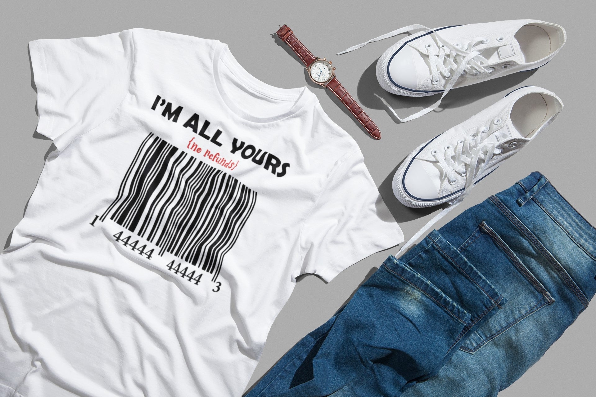 White t-shirt with 'I'm All Yours' text, blue jeans, white sneakers, and a watch on a gray background