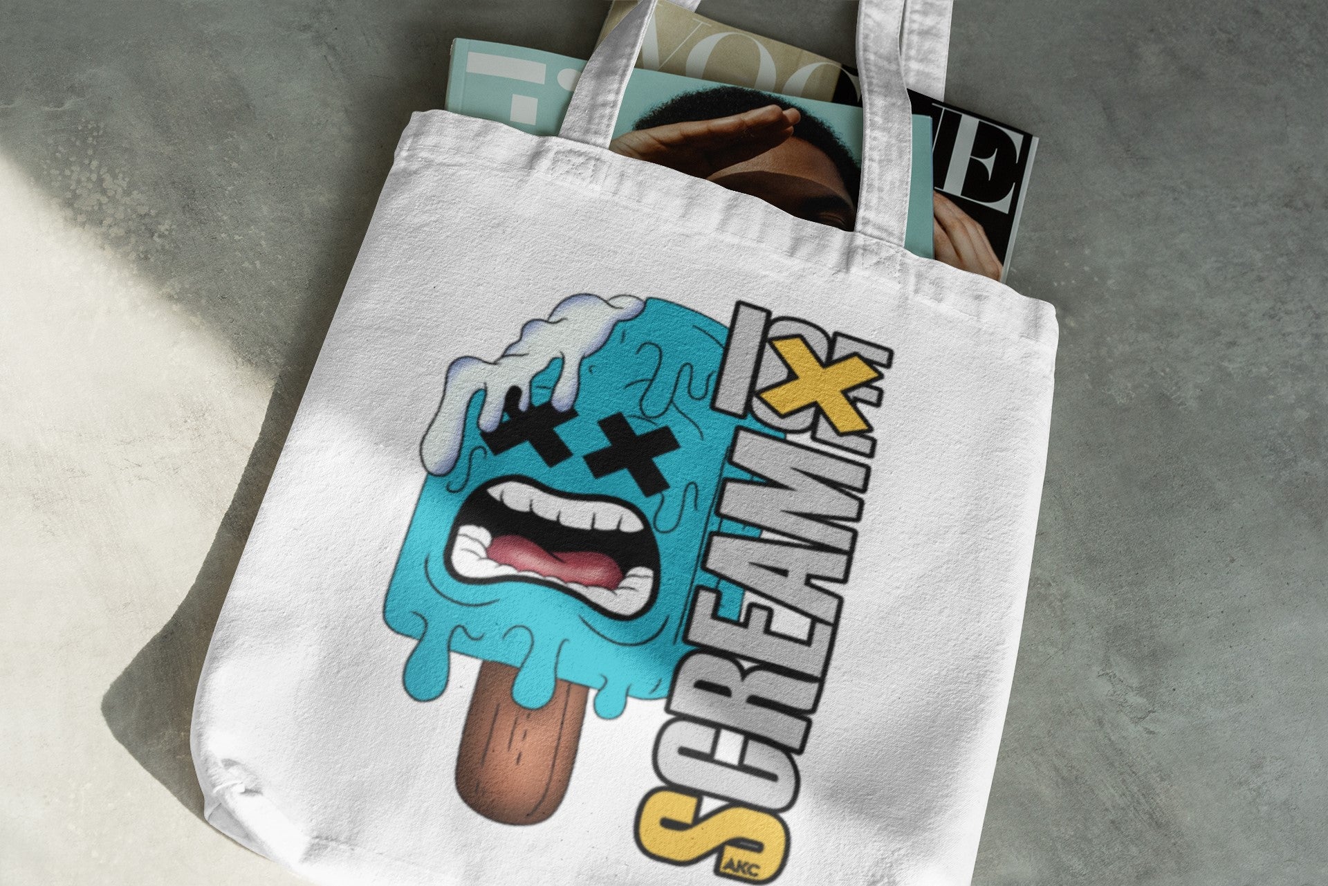 Tote bag with a colorful graphic design on a gray surface