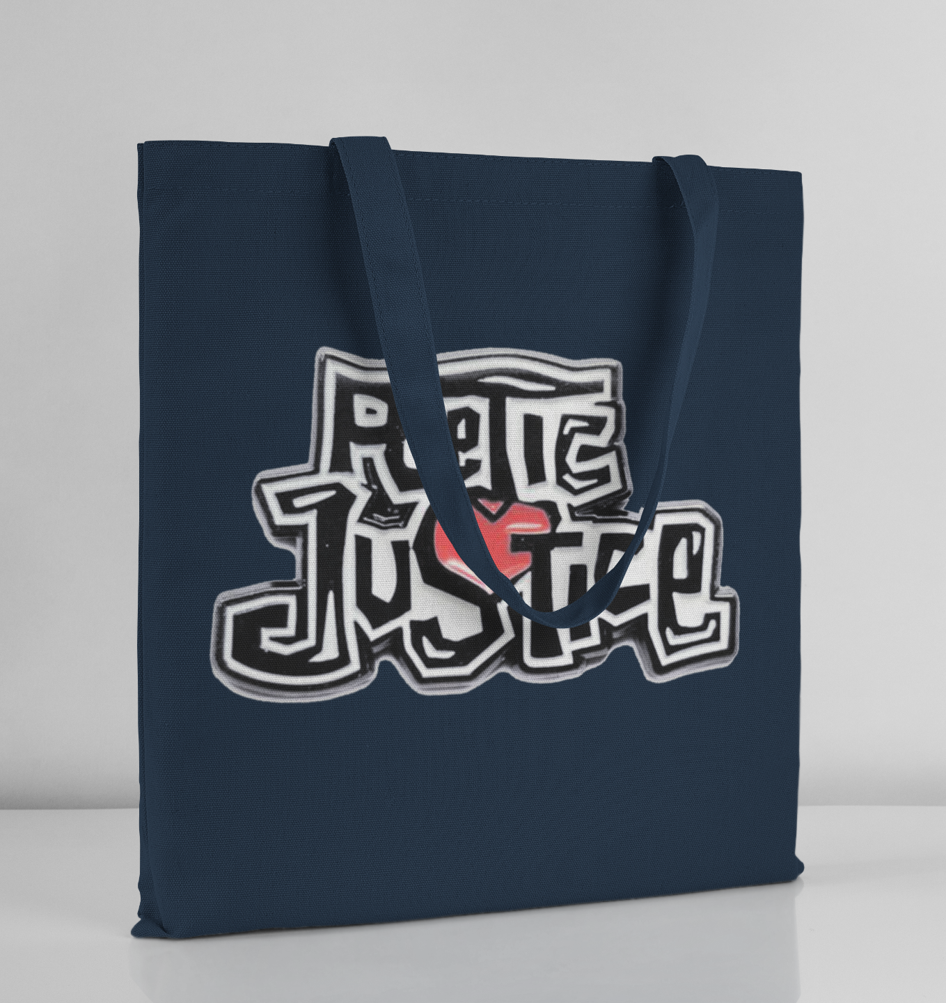 Navy blue tote bag with graphic design on a light gray background