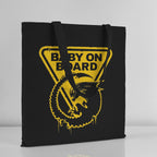 Black tote bag with yellow 'Baby on Board' graphic on a light gray background