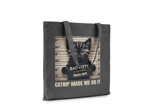 Tote bag with a cat graphic and text on a white background