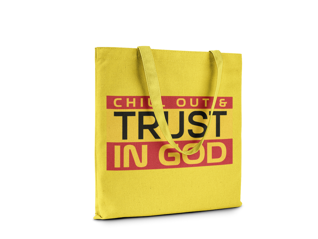 Yellow tote bag with text 'CHILL OUT & TRUST IN GOD' on a white background