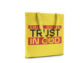 Yellow tote bag with text 'CHILL OUT & TRUST IN GOD' on a white background