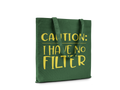 Green tote bag with yellow text 'CAUTION: I HAVE NO FILTER' on a white background