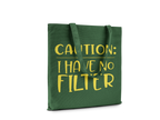 Green tote bag with yellow text 'CAUTION: I HAVE NO FILTER' on a white background