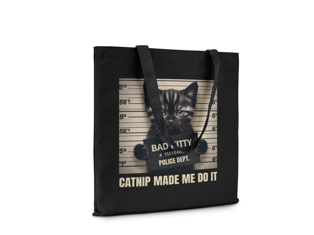Black tote bag with a kitten graphic and text on a white background
