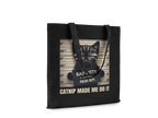 Black tote bag with a kitten graphic and text on a white background