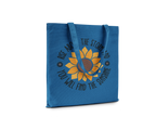 Blue tote bag with sunflower design and motivational quote on a white background
