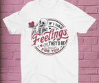 White t-shirt with skeleton graphic and text on a pink brick wall background
