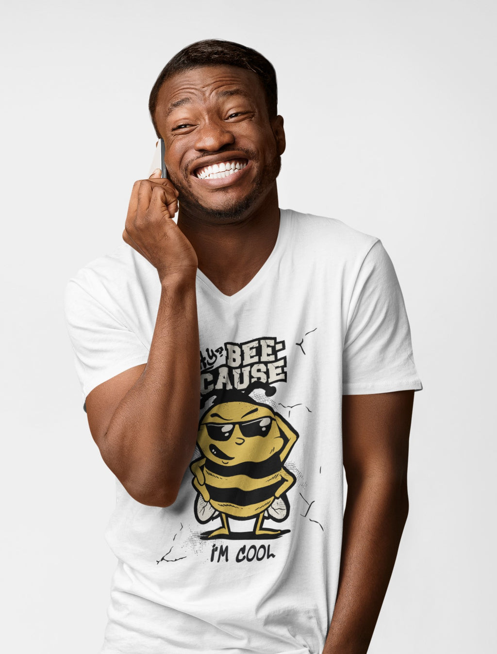 Man wearing a white t-shirt with a bee graphic and text on a light gray background