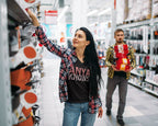 Woman shopping in a store with a man in the background